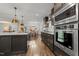 Modern kitchen featuring stainless steel appliances, granite countertops, and ample storage at 4112 Huckleberry Dr, Raleigh, NC 27612