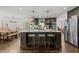 Spacious kitchen with large center island, pendant lighting, and stainless steel appliances at 4112 Huckleberry Dr, Raleigh, NC 27612
