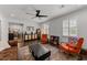 Bright and airy living room featuring a coffee bar and views into the dining room at 4112 Huckleberry Dr, Raleigh, NC 27612