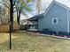 Lush backyard featuring a screen door porch, well-maintained landscaping, and mature trees at 425 Price Ave, Durham, NC 27707