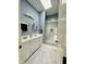 Updated bath boasts dual sinks, quartz counters, sky light, and glass enclosed shower at 425 Price Ave, Durham, NC 27707