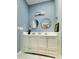 Renovated bathroom with double vanity, modern lighting, and stylish decor at 425 Price Ave, Durham, NC 27707