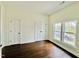 Bedroom with hardwood floors, double windows, and a double-door closet for ample storage at 425 Price Ave, Durham, NC 27707