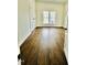 Bright bedroom features dark hardwood floors and double windows providing natural light at 425 Price Ave, Durham, NC 27707