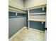 A closet offers lots of storage with shelves, racks, and marble flooring at 425 Price Ave, Durham, NC 27707