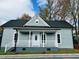 Inviting single-story home showcasing a classic covered front porch and well-maintained landscaping at 425 Price Ave, Durham, NC 27707