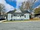 Charming single-story home featuring a welcoming front porch and nicely landscaped front yard at 425 Price Ave, Durham, NC 27707