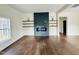 Modern living room featuring hardwood floors, a contemporary fireplace, and an open layout at 425 Price Ave, Durham, NC 27707