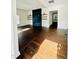 Bright living room with hardwood floors, modern fireplace, and a view into the dining area at 425 Price Ave, Durham, NC 27707