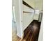 Utility room features a hot water heater and wood shelving for organized storage and functionality at 425 Price Ave, Durham, NC 27707