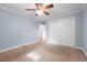 Bedroom featuring carpet, ceiling fan, closet doors, and a doorway entrance at 464 Camp Rd, Burlington, NC 27217