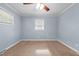 Bedroom with cozy carpet and two windows, providing great lighting throughout the room at 464 Camp Rd, Burlington, NC 27217
