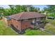 Exterior of a well-maintained brick home with a red roof and manicured lawn at 464 Camp Rd, Burlington, NC 27217