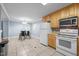 Open kitchen with a view of the dining area, modern appliances, and ample cabinetry for functionality at 464 Camp Rd, Burlington, NC 27217