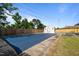 Outdoor pool covered with blue tarp, surrounded by fence, with shed in background at 464 Camp Rd, Burlington, NC 27217