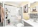 Modern bathroom with a walk-in shower featuring glass doors, complemented by a gray vanity and matching silver accents at 509 Stokes Rd, Graham, NC 27253