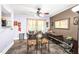 Dining area featuring a ceiling fan, modern flooring, and ample natural light at 509 Stokes Rd, Graham, NC 27253