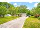 Classic one-story home with a long driveway and lush front lawn at 509 Stokes Rd, Graham, NC 27253