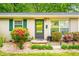 Close up of front door with flowerbed at 509 Stokes Rd, Graham, NC 27253