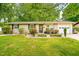 Charming one-story home with landscaped front yard, flowerbeds, and a one car garage at 509 Stokes Rd, Graham, NC 27253