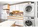 A laundry room with a washer and dryer with tile backsplash at 509 Stokes Rd, Graham, NC 27253