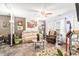 Inviting living area featuring neutral colors, a ceiling fan, modern flooring, and ample natural light at 509 Stokes Rd, Graham, NC 27253