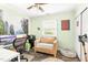 Cozy home office setup with a comfortable chair, desk, and a scenic forest mural creating a serene workspace at 509 Stokes Rd, Graham, NC 27253