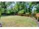Expansive backyard featuring lush green lawn and a modern horizontal fence, perfect for outdoor enjoyment at 512 Page St, Cary, NC 27511