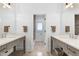 Modern bathroom with dual vanities, large mirrors and marble countertops offers plenty of space and elegant style at 512 Page St, Cary, NC 27511