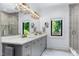 This luxury bathroom includes double sinks, modern lighting, and a glass shower at 512 Page St, Cary, NC 27511