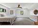 Spacious bedroom with neutral carpet, ceiling fan and ample natural light is move-in ready at 512 Page St, Cary, NC 27511