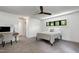 Neutral bedroom features a desk area, ceiling fan, and large window, perfect for work and relaxation at 512 Page St, Cary, NC 27511