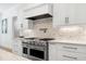 This modern kitchen showcases custom white cabinets and a stainless steel range at 512 Page St, Cary, NC 27511