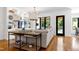 Comfortable living room featuring built-in shelving, modern lighting, and an open view of the backyard at 512 Page St, Cary, NC 27511