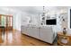 Bright living room featuring hardwood floors, a large sofa and a built-in entertainment center at 512 Page St, Cary, NC 27511