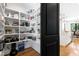 Walk-in pantry features custom shelving adjacent to the main open living area at 512 Page St, Cary, NC 27511