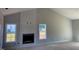 Spacious living room with a modern fireplace and large windows for natural light at 519 Mulberry Rd, Spring Hope, NC 27882