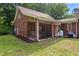 Backyard with brick exterior and covered porch at 5237 Christian Light Rd, Fuquay Varina, NC 27526