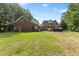 Spacious backyard with lush green lawn and pool, ideal for outdoor entertainment and relaxation at 5237 Christian Light Rd, Fuquay Varina, NC 27526