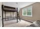 Bedroom with carpet, neutral paint, and a black metal bunk bed at 5237 Christian Light Rd, Fuquay Varina, NC 27526