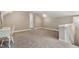 Upstairs bedroom with neutral walls, chair rail, carpet and a door at 5237 Christian Light Rd, Fuquay Varina, NC 27526