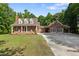 Charming brick home with a welcoming porch, ample parking, and a lush green lawn at 5237 Christian Light Rd, Fuquay Varina, NC 27526