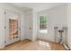 Mud room with door to the exterior, white walls, and light hardwood flooring at 5237 Christian Light Rd, Fuquay Varina, NC 27526