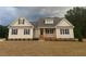 Charming single-story home with a welcoming front porch and well-manicured lawn in a serene neighborhood at 529 Mulberry Rd, Spring Hope, NC 27882