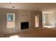 Unfinished living room with windows and a fireplace at 529 Mulberry Rd, Spring Hope, NC 27882