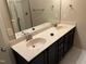Bathroom featuring a dual sink vanity with a solid surface top and a large mirror at 532 Matheson Pl, Cary, NC 27511