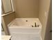 Bathroom featuring a standalone white bathtub at 532 Matheson Pl, Cary, NC 27511