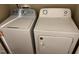 A laundry room featuring a white Whirlpool washing machine and an Amana dryer at 532 Matheson Pl, Cary, NC 27511