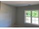 A bright and airy bedroom showcasing a large window with a view of the outdoors at 539 Mulberry Rd, Spring Hope, NC 27882