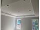 Bright bedroom with tray ceiling, crown molding, and two large windows at 539 Mulberry Rd, Spring Hope, NC 27882